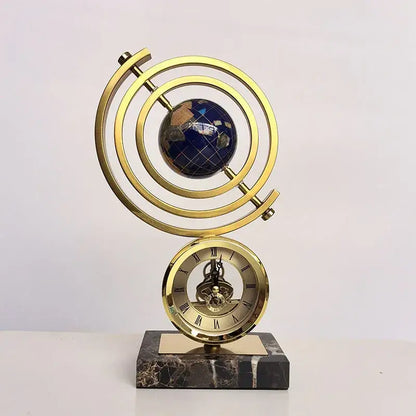 Gold and blue clock globe decoration with lapis lazuli earth sphere roman numeral dial on dark marble base by decorbites