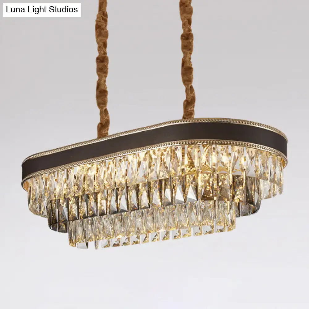 DecorBites 10-light ellipse island pendant with cascading clear and smoky crystal prisms in black bronze frame