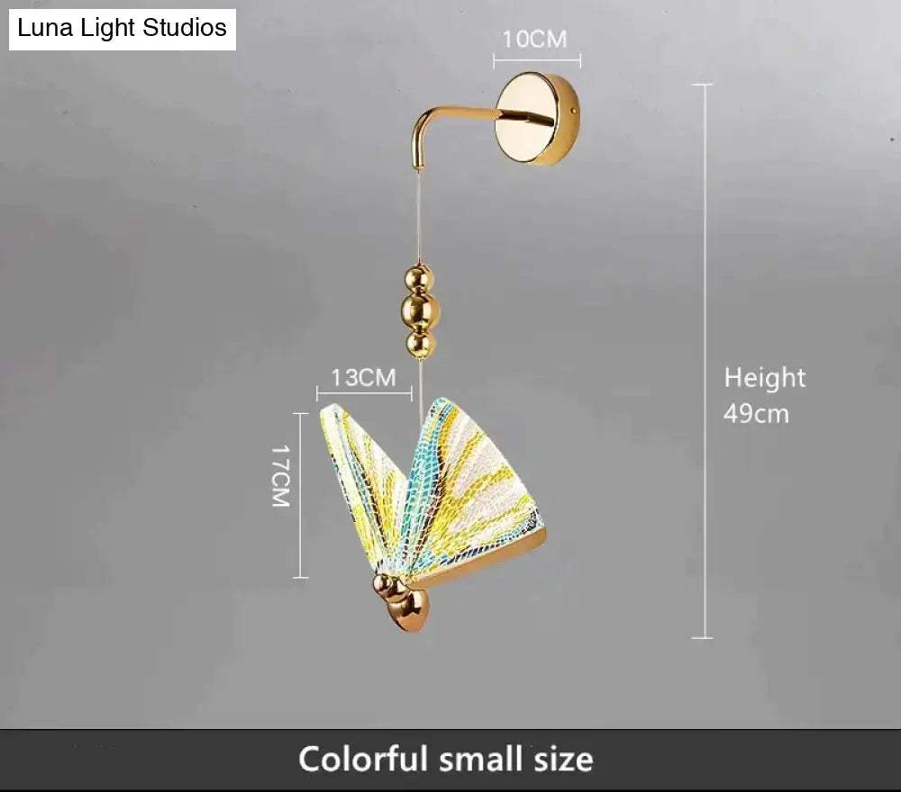 Gold and patterned butterfly led wall light with gold finish and colorful yellow teal wings for bedroom decor