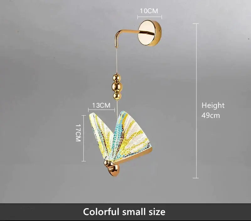 Gold and patterned butterfly led wall light with decorative gold-toned frame and iridescent yellow blue wings for bedroom