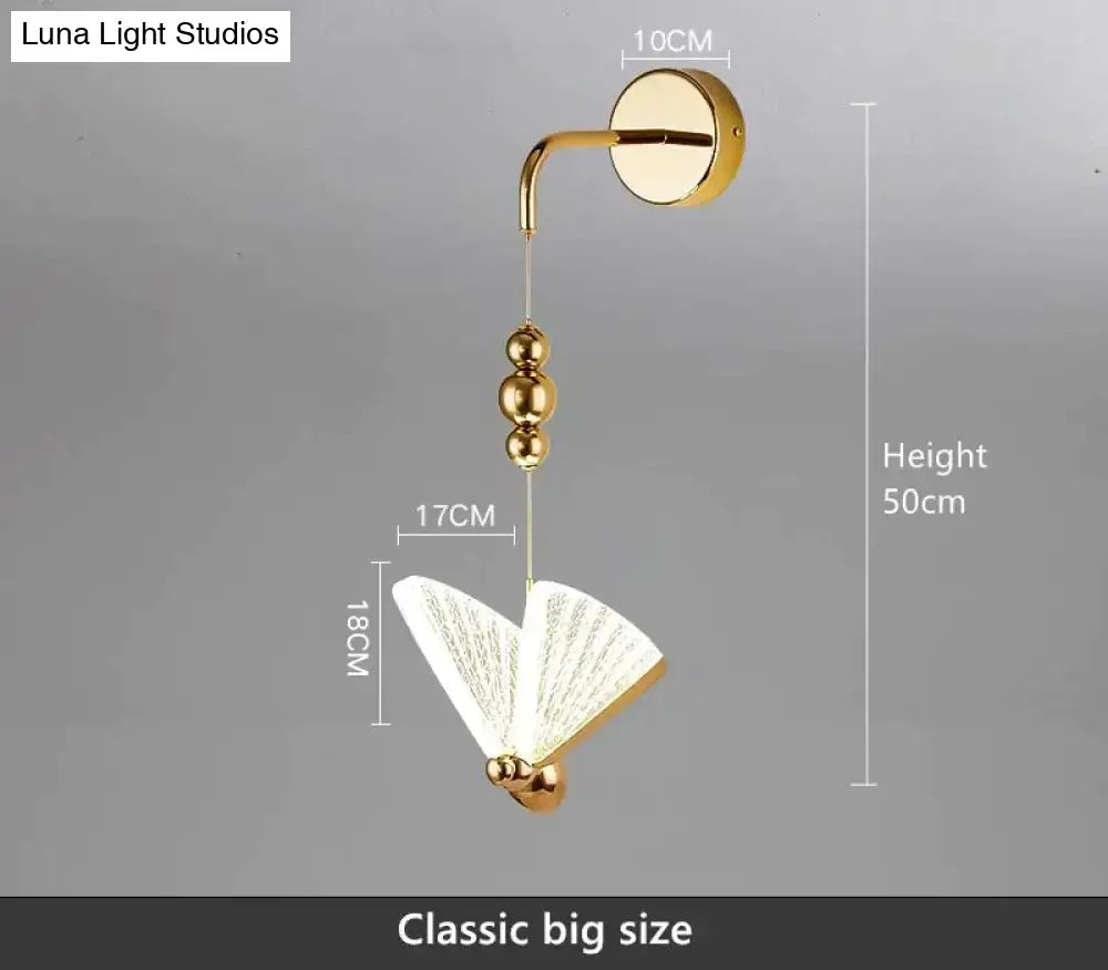 Gold finished nordic butterfly led wall light with fan-shaped white glass shade and three beads on hanging chain