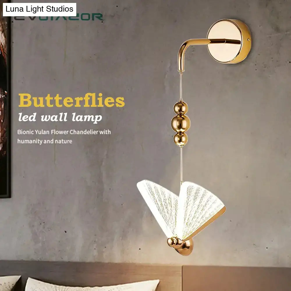 Gold and patterned butterfly led wall light with gold finish and translucent fan-like wings for bedroom wall light decor