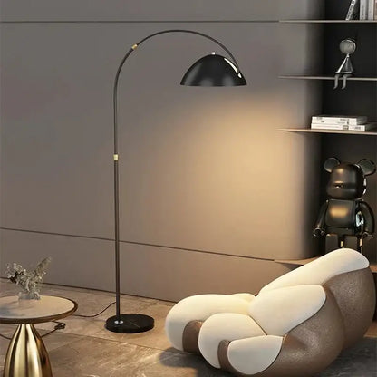 Black arched floor lamp with sleek curved metal frame and glossy dome shade for decorbites designer marble floor lighting