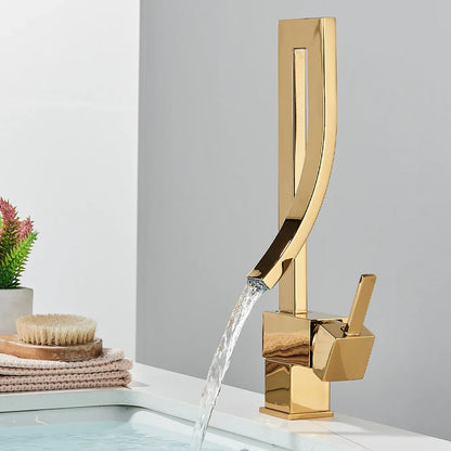 Gold-colored single hole bathroom basin faucet deck mounted with sleek angular design and flowing water stream