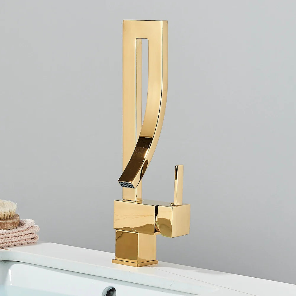 Gold single hole deck mounted bathroom basin faucet with sleek angular design and polished metallic finish