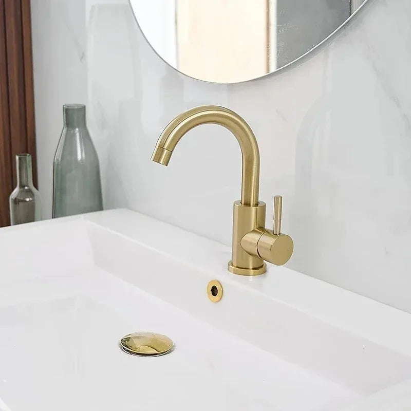 Gold bathroom faucet with stainless steel single-handle and curved spout with matching drain flange