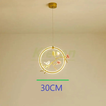 Gold-toned bird led chandelier with ornate branch design pink roses and white bird for dining room decorbites bird led
