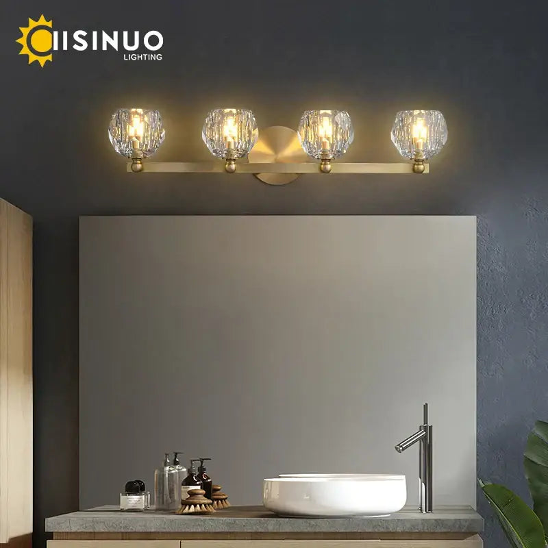 Gold brass vanity light fixture with four crystal glass globe shades ideal for bathroom vanity light fixtures