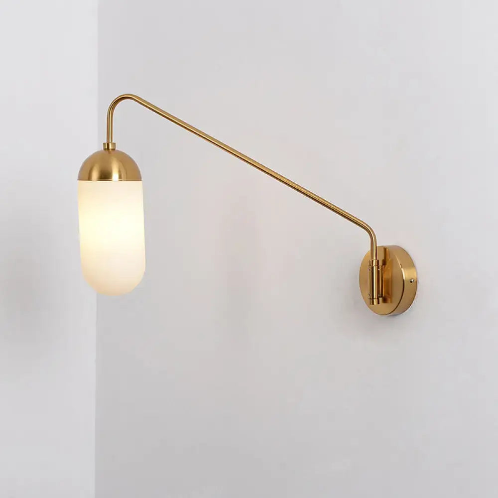 Gold brass wall lamp with curved arm and frosted glass wall sconce ideal for bedroom lighting