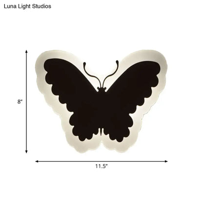 Black butterfly-shaped wall light with soft white glow ideal for children’s bedroom wall lights and decor