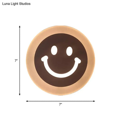 Gold and brown crescent led wall light with smiling face design for children’s bedroom wall light decor