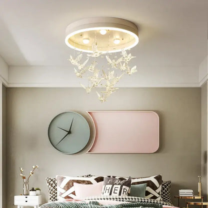 Gold butterfly crystal led ceiling lamp with white frame and clear bird-shaped pendants for kids bedroom decorbites crystal led