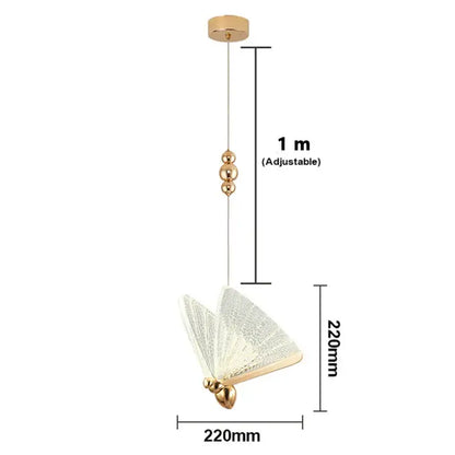 Gold butterfly pendant light with acrylic elements and textured translucent wings works beautifully in a bedroom