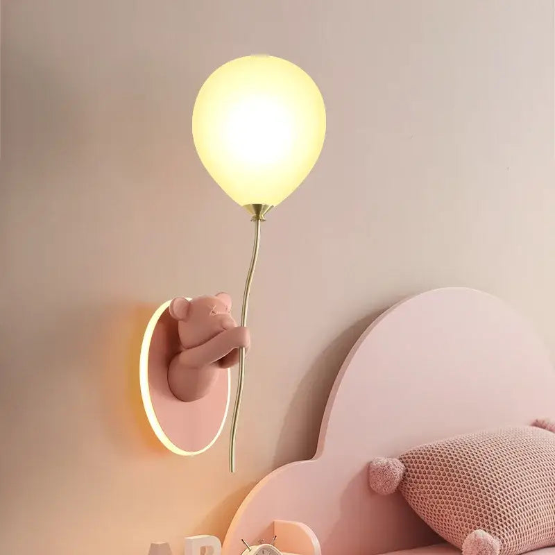 Pastel pink decorbites cartoon bear wall lamp holding a glowing yellow balloon for children’s bedroom decor