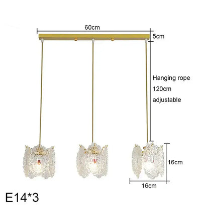 Gold-toned glass pearl chandelier with carved glass pearl shades and adjustable ropes for dining room decorbites decor