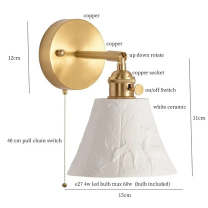 Gold ceramic led wall sconce featuring a white ceramic led wall shade with embossed deer and branch patterns on brass copper fixture