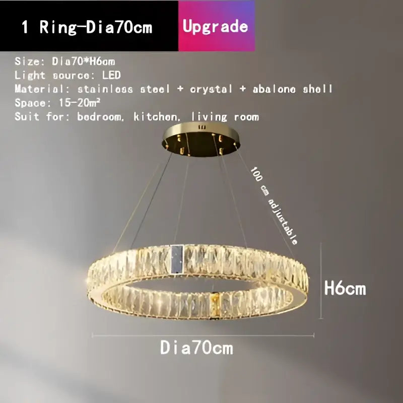 A modern gold circular decorbites crystal led chandelier with stainless steel frame and sparkling crystal accents for dining room