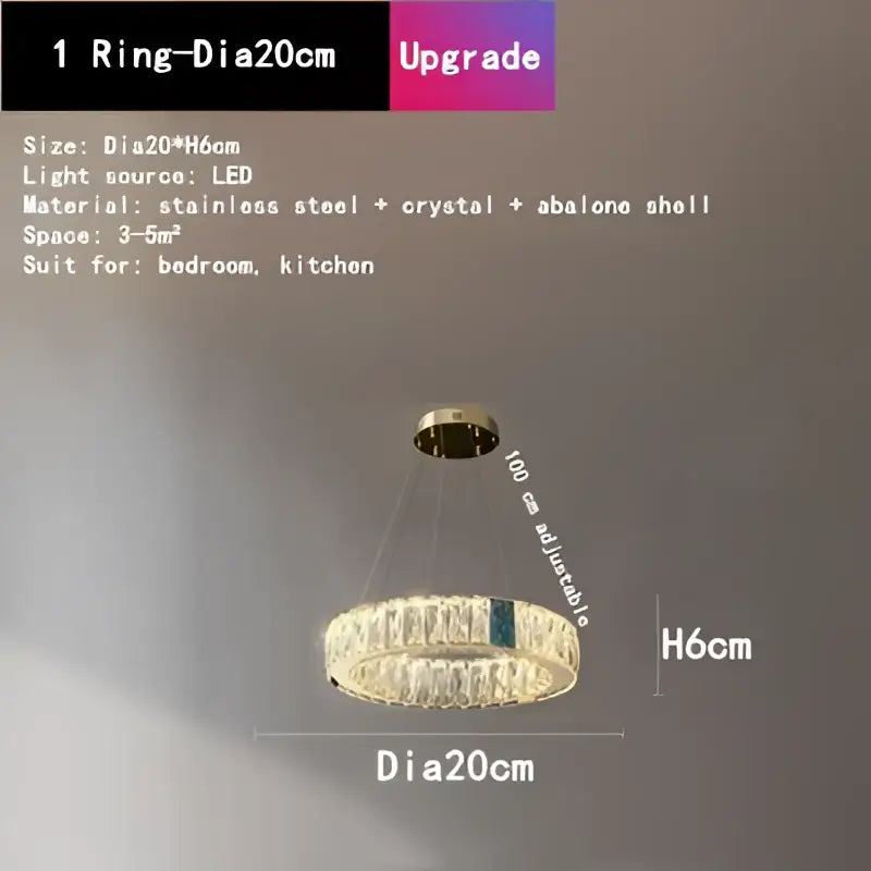 A gold decorbites crystal led chandelier with circular stainless steel frame, crystals, and abalone shell accent for dining room