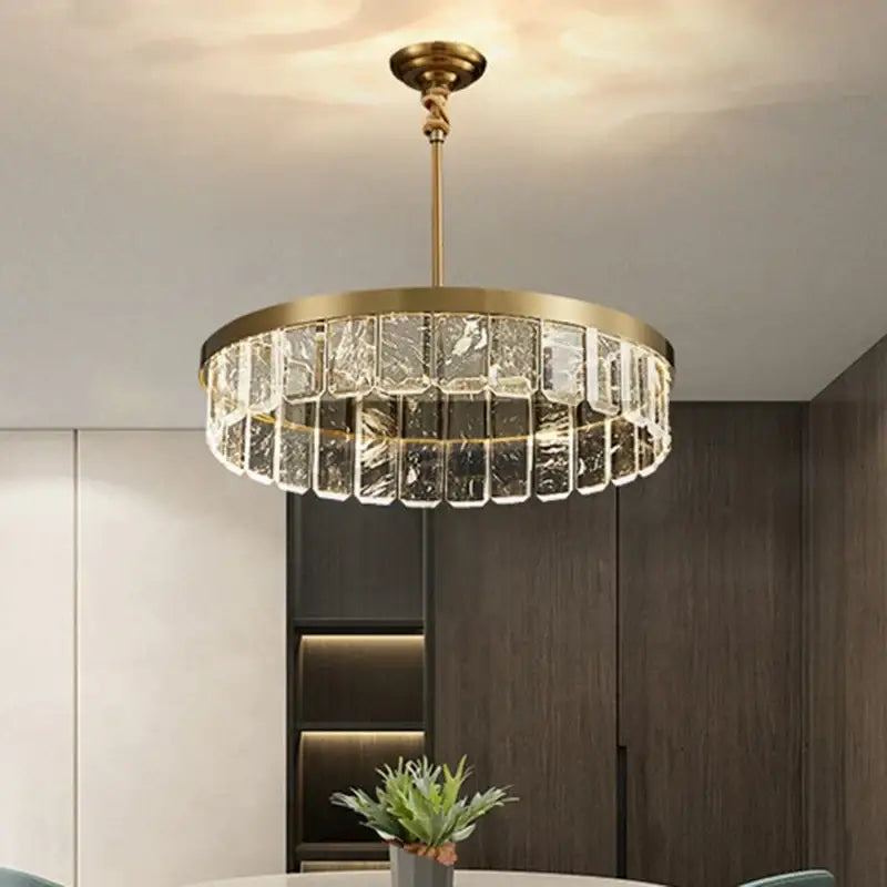 Brass-finished gold cloud mist crystal chandelier with clear rectangular prisms in circular pattern for dining room decorbites cloud mist