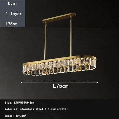 Gold-toned oval dining room pendant light with a single layer of cloud mist crystal accents from decorbites cloud mist