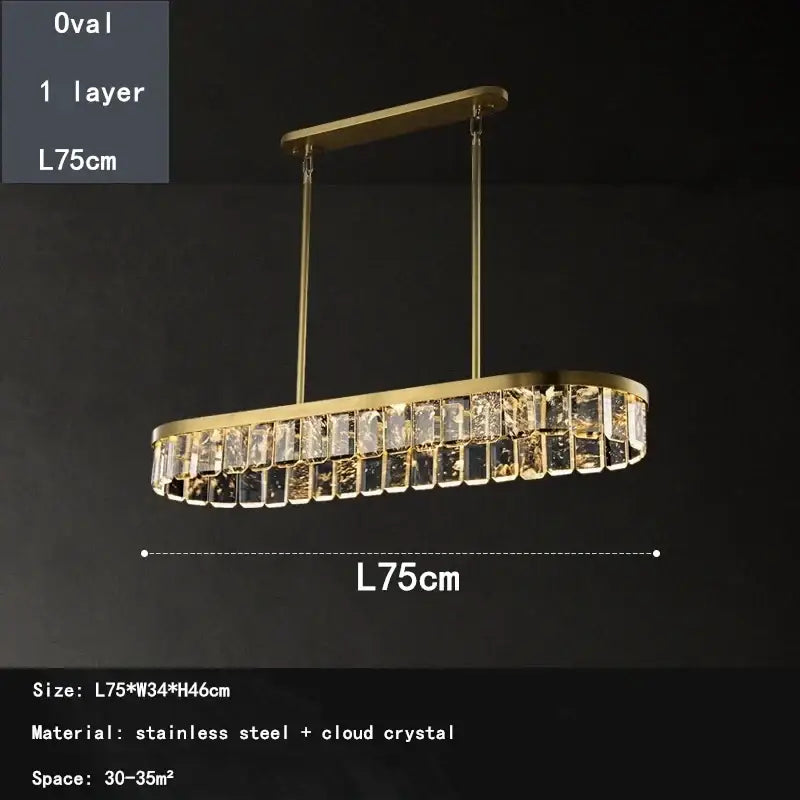 Gold-toned oval dining room pendant light with a single layer of cloud mist crystal accents from decorbites cloud mist