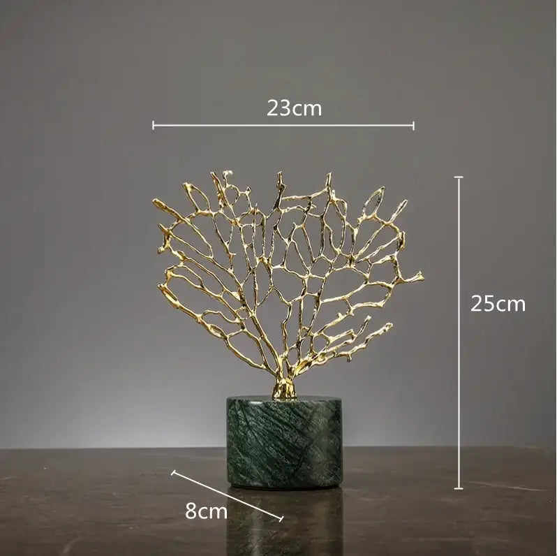 Golden metallic coral crystal tree sculpture with intricate branches on dark green marble base for living room decor