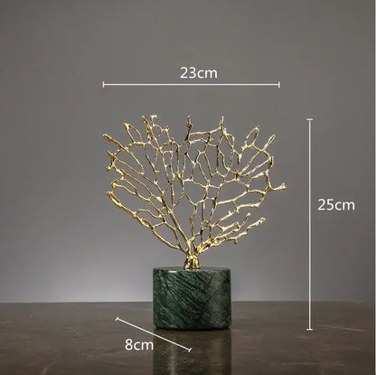Golden metallic coral crystal tree sculpture with intricate branches on dark green marble base for living room decor