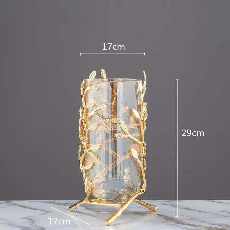 A tall transparent glass vase with golden leaf and branch metal frame coral crystal tree living room decor