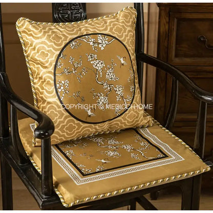 Gold-toned satin lumbar pillow case with intricate white crane birds branches embroidery and geometric borders for living room