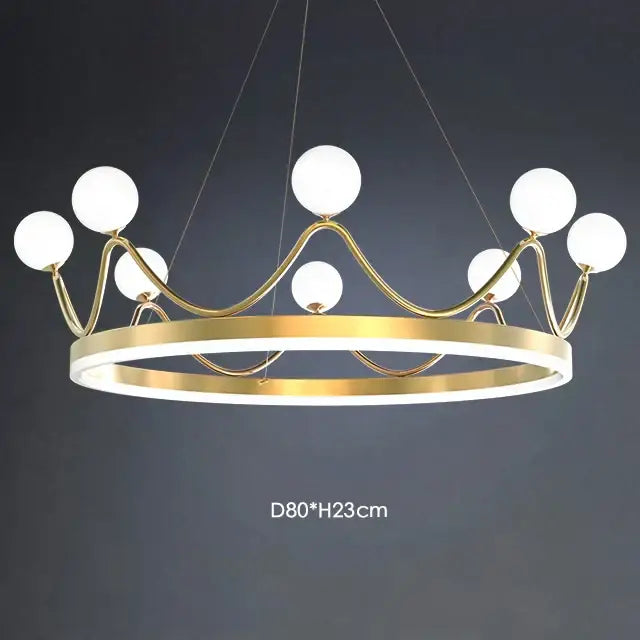 Gold-toned decorbites crown led chandelier with white spherical bulbs and glowing base for kids room lighting