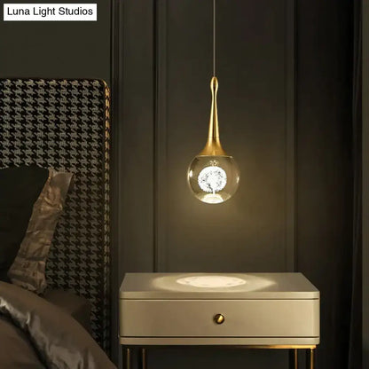 Gold-toned DecorBites Clara pendant lights with teardrop crystal glass globe and illuminated led crystal glass dandelion design