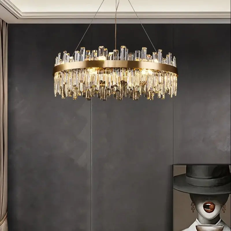 A gold crystal led oval chandelier with a metal frame and clear crystal prisms for dining room decorbites crystal led