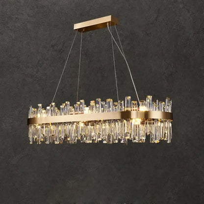 Gold-toned crystal led oval chandelier with cascading clear crystal rods and sleek metallic frame for dining room decorbites crystal led