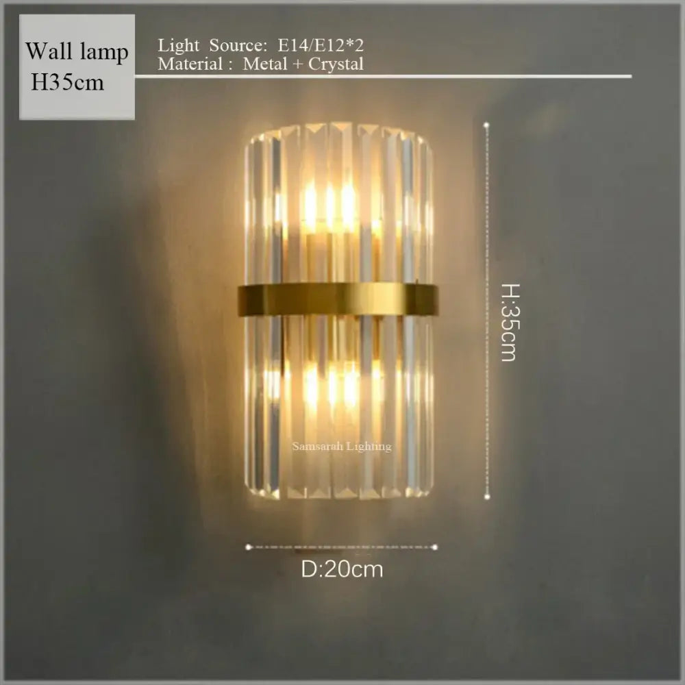 Gold-toned decorbites crystal led oval wall lamp with vertical crystal rods and central metallic band for elegant lighting