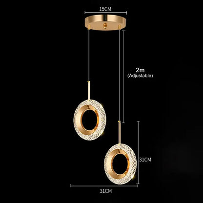 Gold-toned led pendant light with two crystal-encrusted circular shades suspended by adjustable cords for luxury dining room