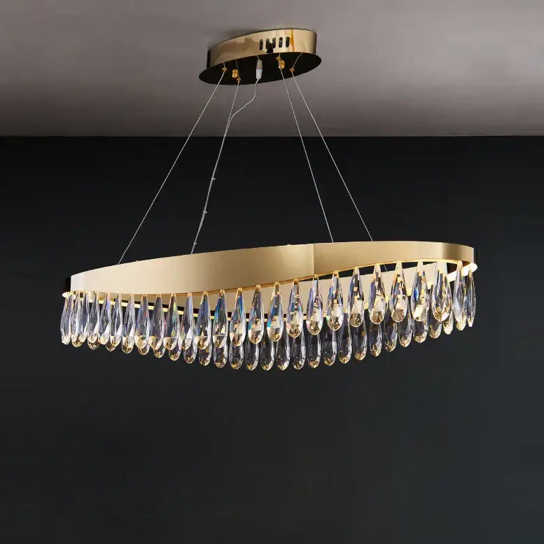 Gold-toned circular chandelier with dangling crystal teardrop pendants made of decorbites crystal stainless steel for foyer decor
