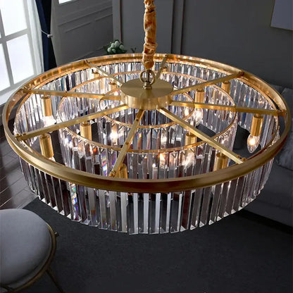 Gold dual purpose crystal ceiling lamp featuring multiple tiers of clear prisms on a brass fixture by decorbites