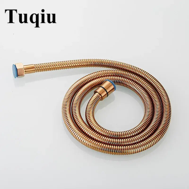 A rose gold flexible stainless steel shower hose with ribbed texture and blue-tipped brass fittings for bathroom use