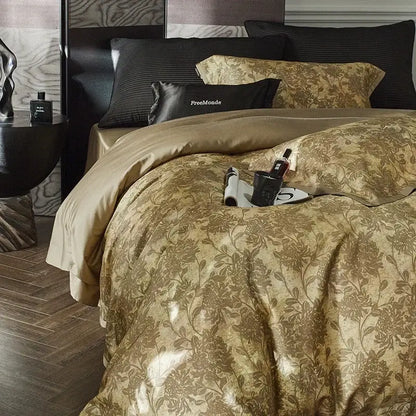 Luxurious gold floral satin cotton bedding set with intricate pattern and matching pillowcases plus black accent pillow