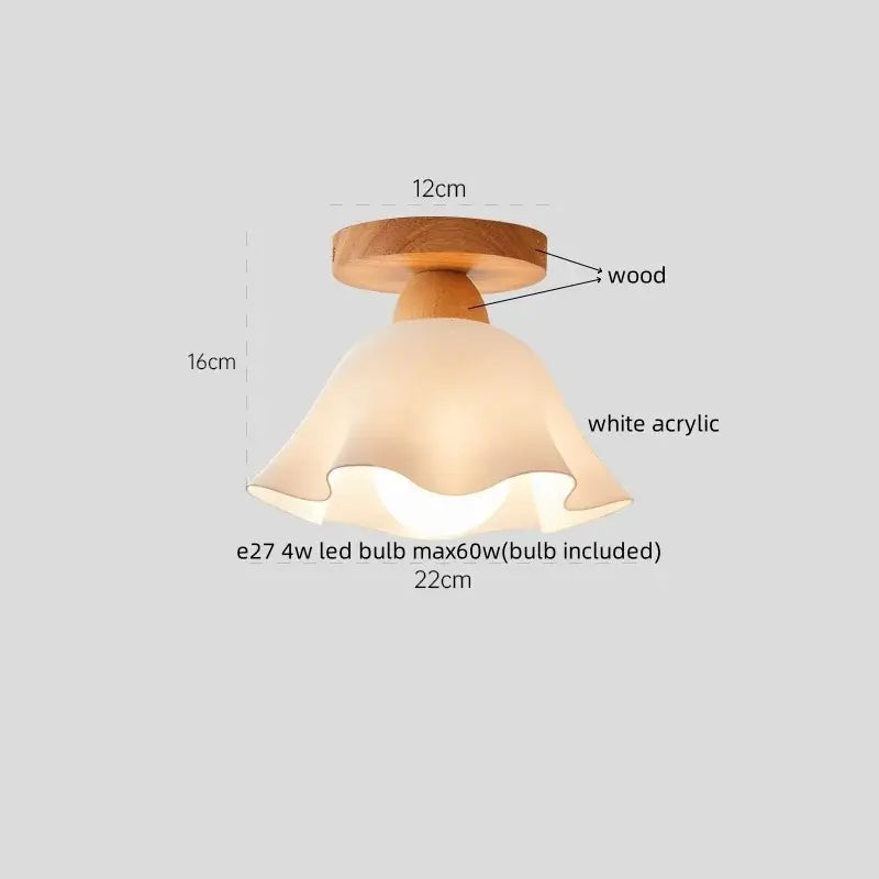 A warm-toned gold flower frosted glass ceiling lamp with a white cotton shape led acrylic lampshade on a wood base