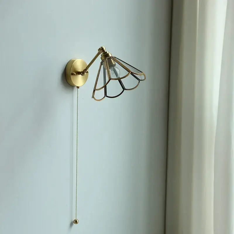 Brass-finished wall sconce with fan-shaped metal cage and pull chain wall lamp for bedroom decorbites copper wall style