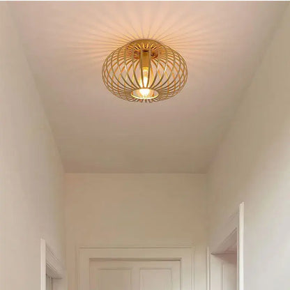 Gold iron art ceiling light with golden woven wireframe design and warm radiant glow for living room decorbites iron art ceiling light