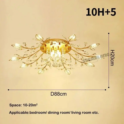 Gold-toned decorbites crystal ceiling chandelier with crystal leaves and dangling crystals in branch-like design