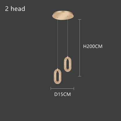 Gold-toned lustre oval acrylic chandelier with textured sparkling surface and two hanging lights for dining room decorbites gold lustre