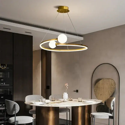 Modern gold nordic ring led chandelier featuring two white glass bulbs suspended by thin cords for dining room decorbites gold nordic