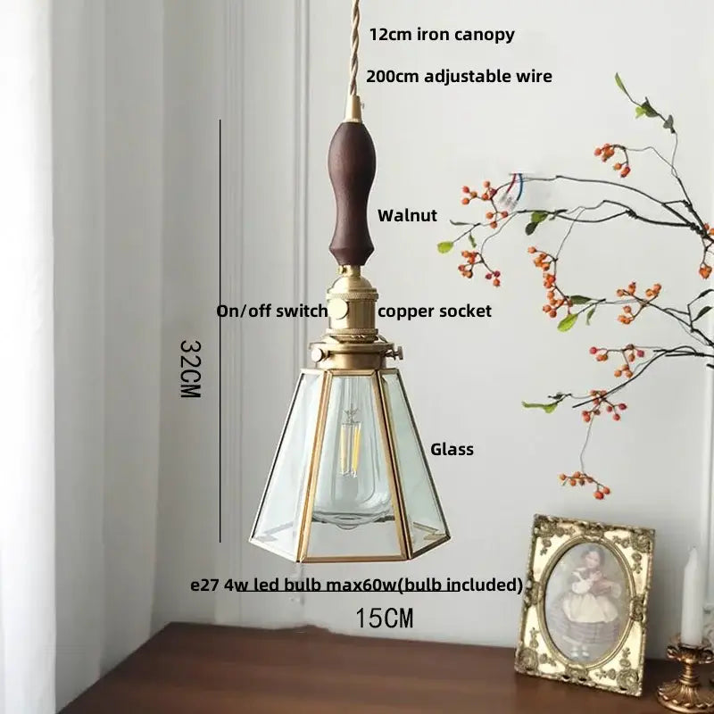 Gold petal glass led pendant lamp with dark walnut wooden handle brass accents and clear glass panels framed by gold metal