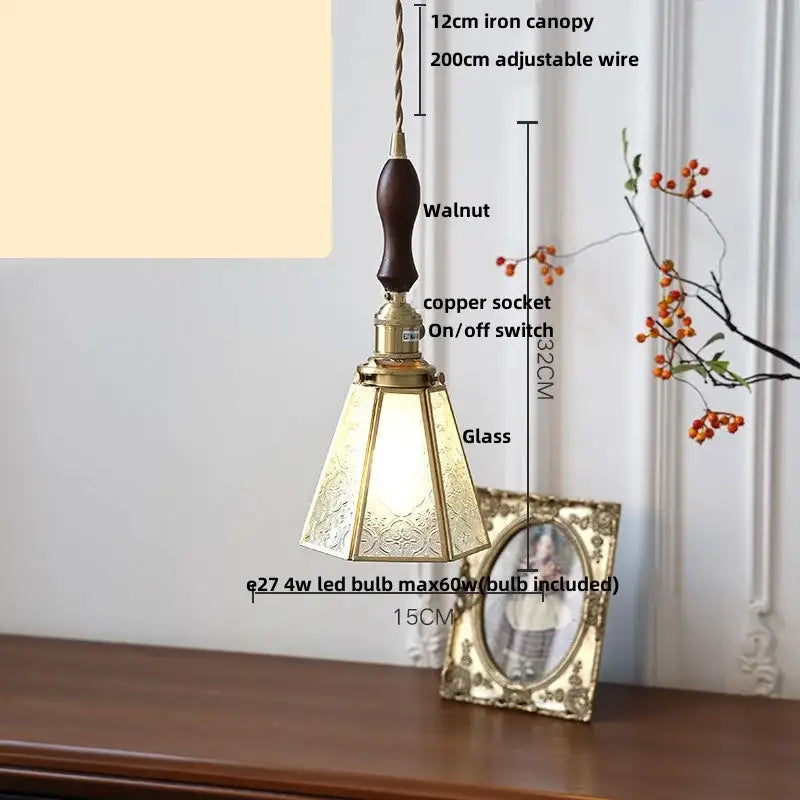 Gold petal glass led pendant lamp featuring a walnut wood handle, brass accents, and etched ornate glass shade
