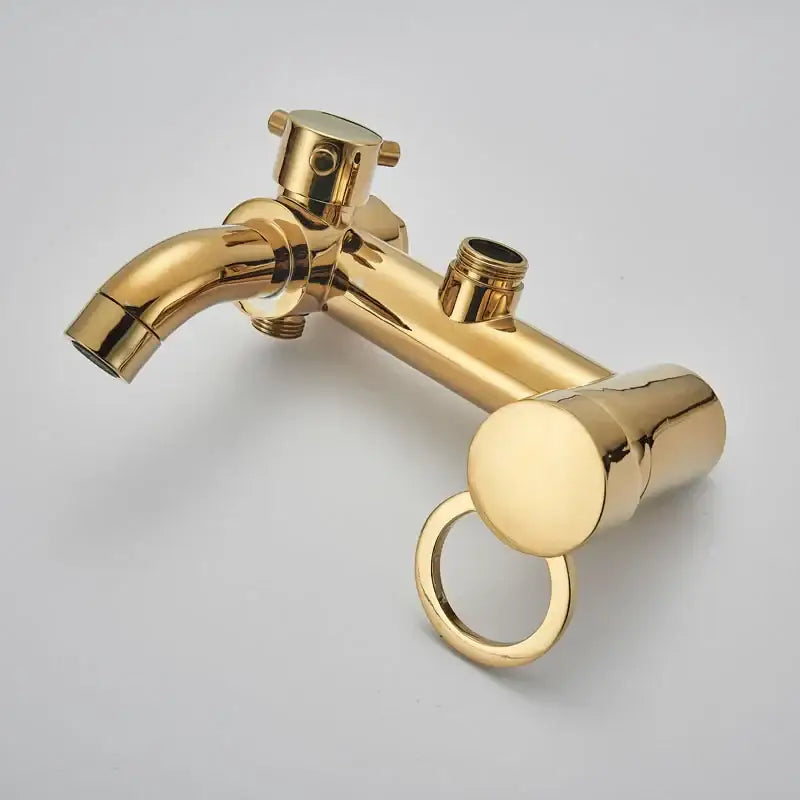 Gold-finished brass shower faucet set with a sleek modern design featuring curved spout and integrated handle