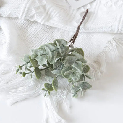 Faux eucalyptus branch with soft frosted green leaves and brown stem from decorbites eucalyptus leaves artificial plants decor