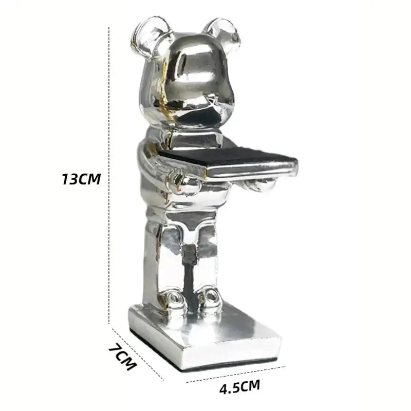 Silver metallic bear statue watch rack holding a black rectangular tray for bedroom storage and display